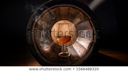 Foto stock: Cognac In Glass On The Wood