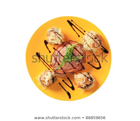 [[stock_photo]]: Mushrooms Stuffed With Ground Meat And Bacon Wrapped Pork Fillet