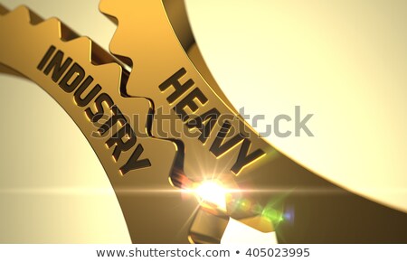 Foto stock: Heavy Industry Concept Golden Cogwheels