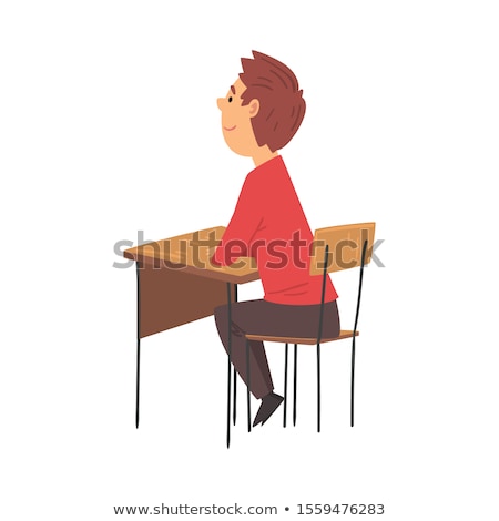 ストックフォト: Side View Of Schoolkids Studying And Sitting At Desk In Classroom Of Elementary School