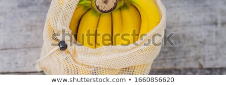 Stock foto: Fruit In A Reusable Bag On A Stylish Wooden Kitchen Surface Zero Waste Concept Plastic Free Concep