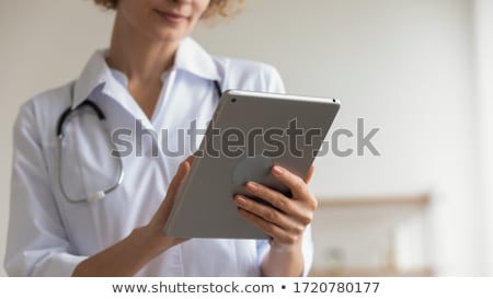 Stockfoto: Female Medic Reading Notes