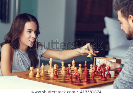 Foto stock: Loving Couple Playing Chess Together