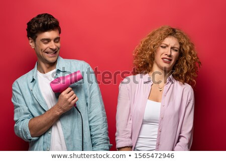 Stockfoto: Two Young Girlfriends With Hair Dryers