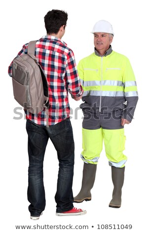 Foto stock: Builder Greeting Young Trainee