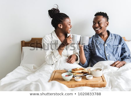 Foto stock: Couple Having Breakfast In Bed