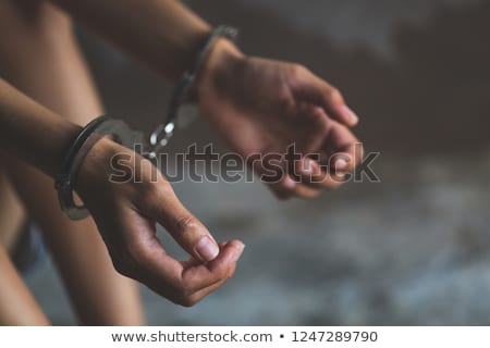 Foto d'archivio: Woman With Hands And Handcuffs