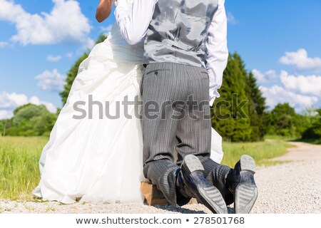 Foto stock: Groom Begging Bride For Mercy After Bridal Kidnapping