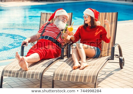 Foto stock: Young Man Lying On Sunbed Near Pool Summer Vacation And Travel