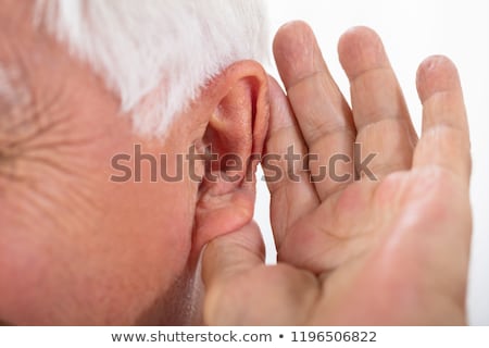 Foto stock: Man Trying To Hear After Inserting Hearing Aid