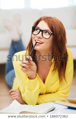 Stock photo: Redhead Teenage Student Girl In Glasses Dreaming