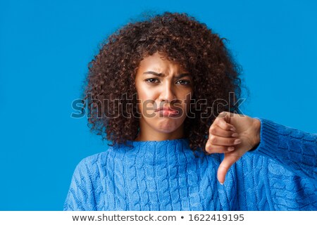 Foto stock: Disappointed African Traveler With Thumb Down