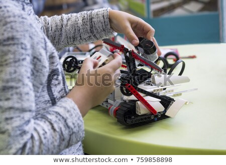 Stok fotoğraf: Close Up Of Boy Building Robot At Robotics School