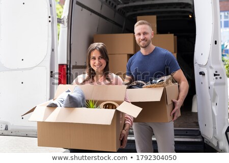 Stock foto: Couple In A Van Smiling With A Woman