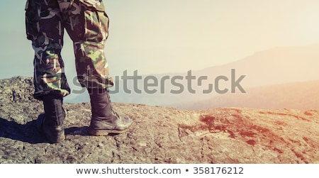 Foto stock: Military Soldier Standing With Ammunition