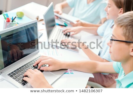 Stock foto: Clever Learners Of Middle School Touching Keys Of Laptop Keypad