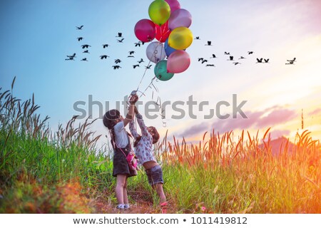 Сток-фото: Happy Kids With Balloons On A Walk