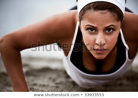 Сток-фото: Woman Doing Pushups In The Park