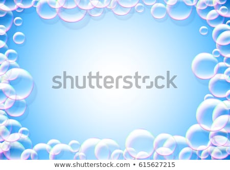 Zdjęcia stock: Soap Bubbles Abstract Blue Background With Rainbow Colored Airy