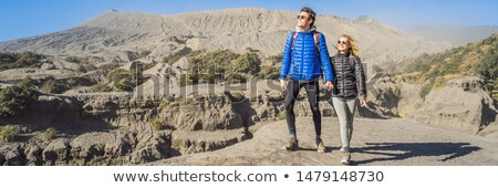 Stok fotoğraf: Banner Long Format Young Couple Man And Woman Visit The Bromo Volcano At The Tengger Semeru Nationa