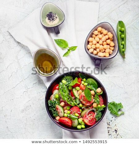 Foto d'archivio: Fresh Vegetarian Vegetables Salad With Tomatoes And Cucumber Lettuce And Spinach In Grey Bowl With