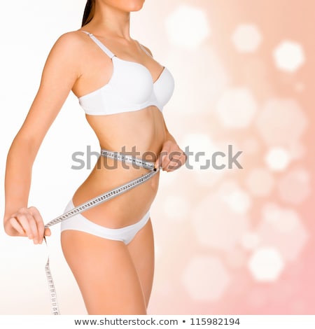 Сток-фото: Woman Taking Measurements Of Her Body On Blurry Background