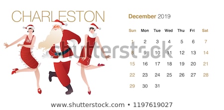 Stockfoto: Happy Young Couple Wearing Santa Claus Clothes