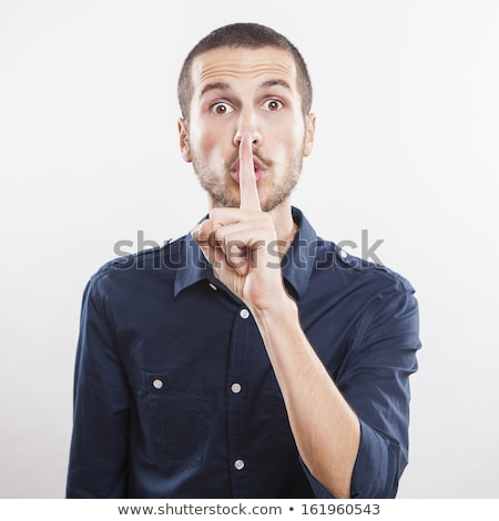 Foto stock: Finger On Lips Man Gesturing Shhh Sign