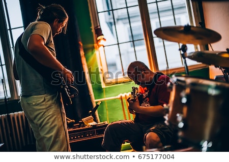 Foto stock: Alternative Rock Music Singer Singing Song Into Microphone