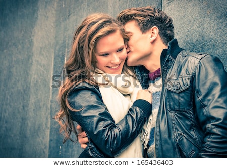 [[stock_photo]]: A Young Man Whispering To A Woman