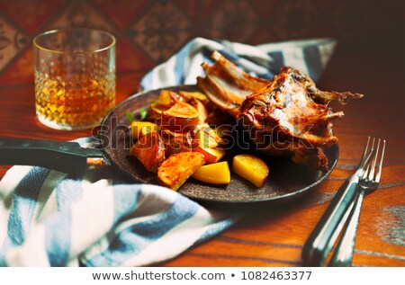 Foto d'archivio: Braised Goat Meat With Sauce And Roasted Potatoes In The Pan