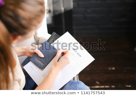 Сток-фото: Woman Filling Visa Application Form