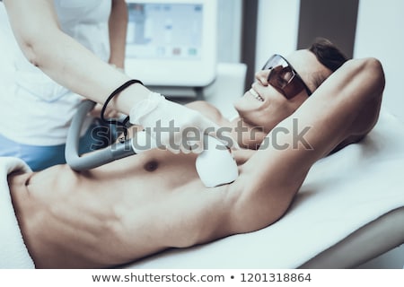 Сток-фото: Young Man Visiting Doctor For Epilation