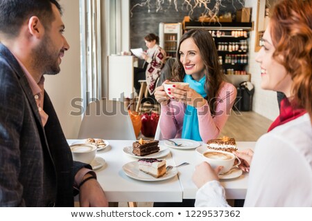 Stockfoto: Three Best Friends Relaxing Together With Cakes And Coffee