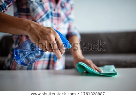 Foto stock: Female Janitor With Spray Bottle