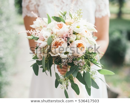 Stok fotoğraf: Beautiful Wedding Bouquet In Hands Of The Bride