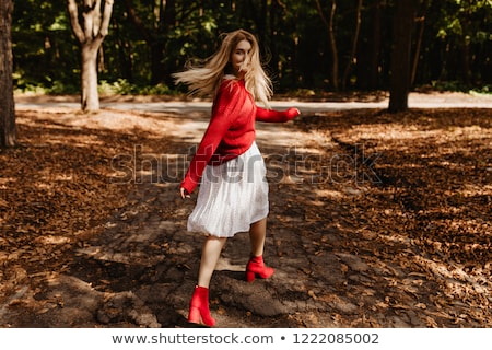 Stok fotoğraf: Portrait Of An Excited Young Woman Wearing Red Hat