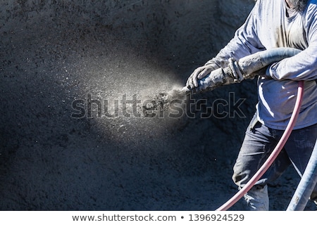 Foto d'archivio: Pool Construction Worker Shooting Concrete Shotcrete Or Gunite