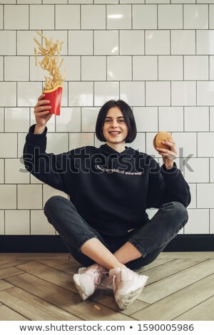 Foto d'archivio: Girl Throwing French Fries