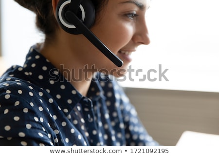 Imagine de stoc: Young Smiling Hotline Consultant In Headset Answering Question Of Client