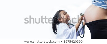 [[stock_photo]]: Joyful Little Brother Listening Stethoscope Belly