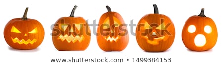 Foto d'archivio: Pumpkin Lantern On Yellow Background