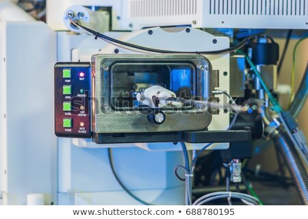 Zdjęcia stock: Scientist In A Laboratory Works With An Electron Microscope Gateway Putting A Sample Into A Chamber