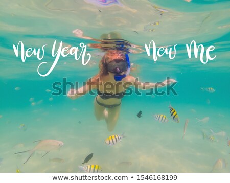 Stock photo: New Year New Me Concept Happy Woman In Snorkeling Mask Dive Underwater With Tropical Fishes In Coral