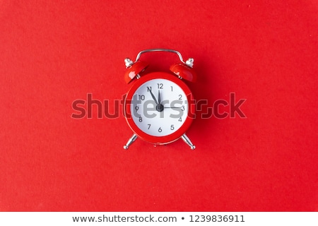 Foto stock: Creative Clock Red Color On The White