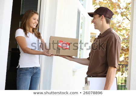 Foto stock: Smiling Young Woman Working Outdoors On A Porch