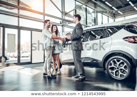 Stock fotó: Woman Choosing Car For Buying In Dealership