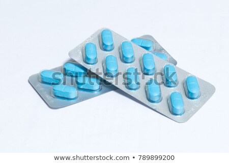 Stok fotoğraf: Pack Of Pink Tablets Isolated On White Background