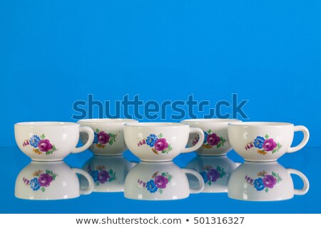 Stock foto: Very Old Porcelain Tea Set On Blue Reflection Background