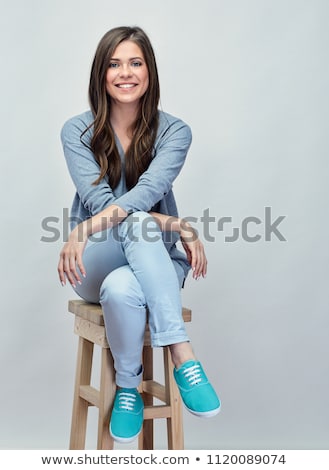 Сток-фото: олодая · девушка, · сидящая · в · студии